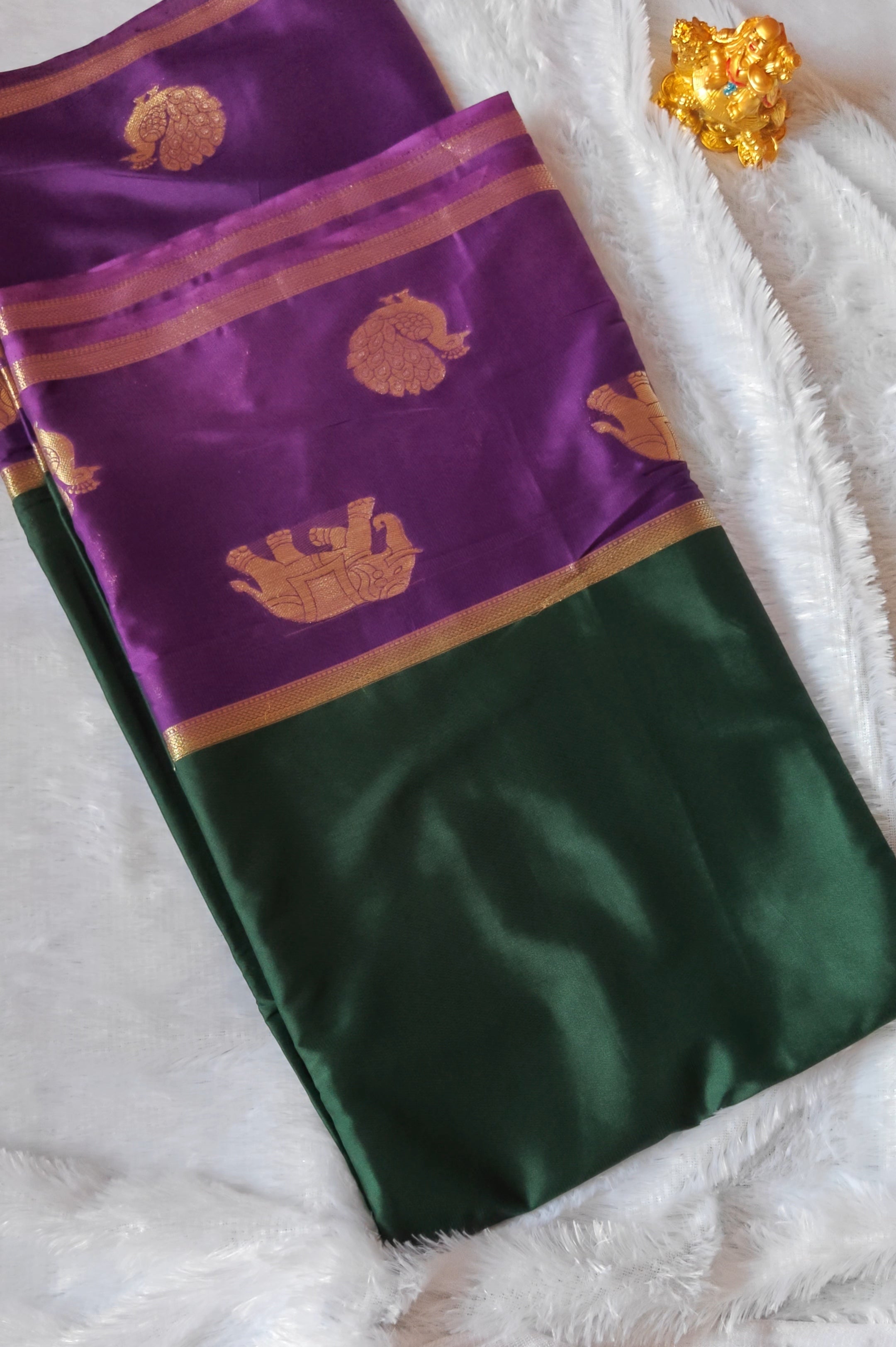 SV09            Semi Mysore crepe silk with Elephant and peacock gold zari butta design in border.